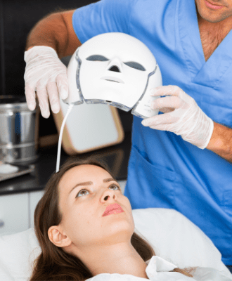 Woman having LED facial treatment