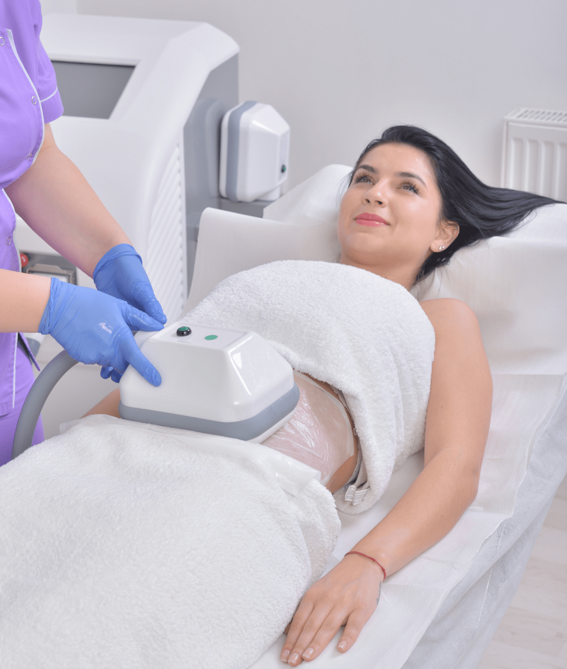 Woman having fat freezing treatment on stomach