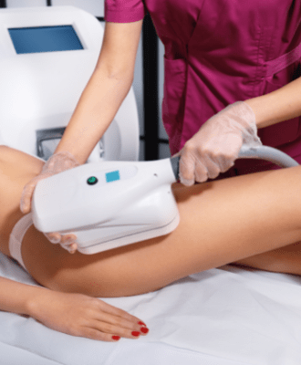Woman having fat freezing treatment on leg